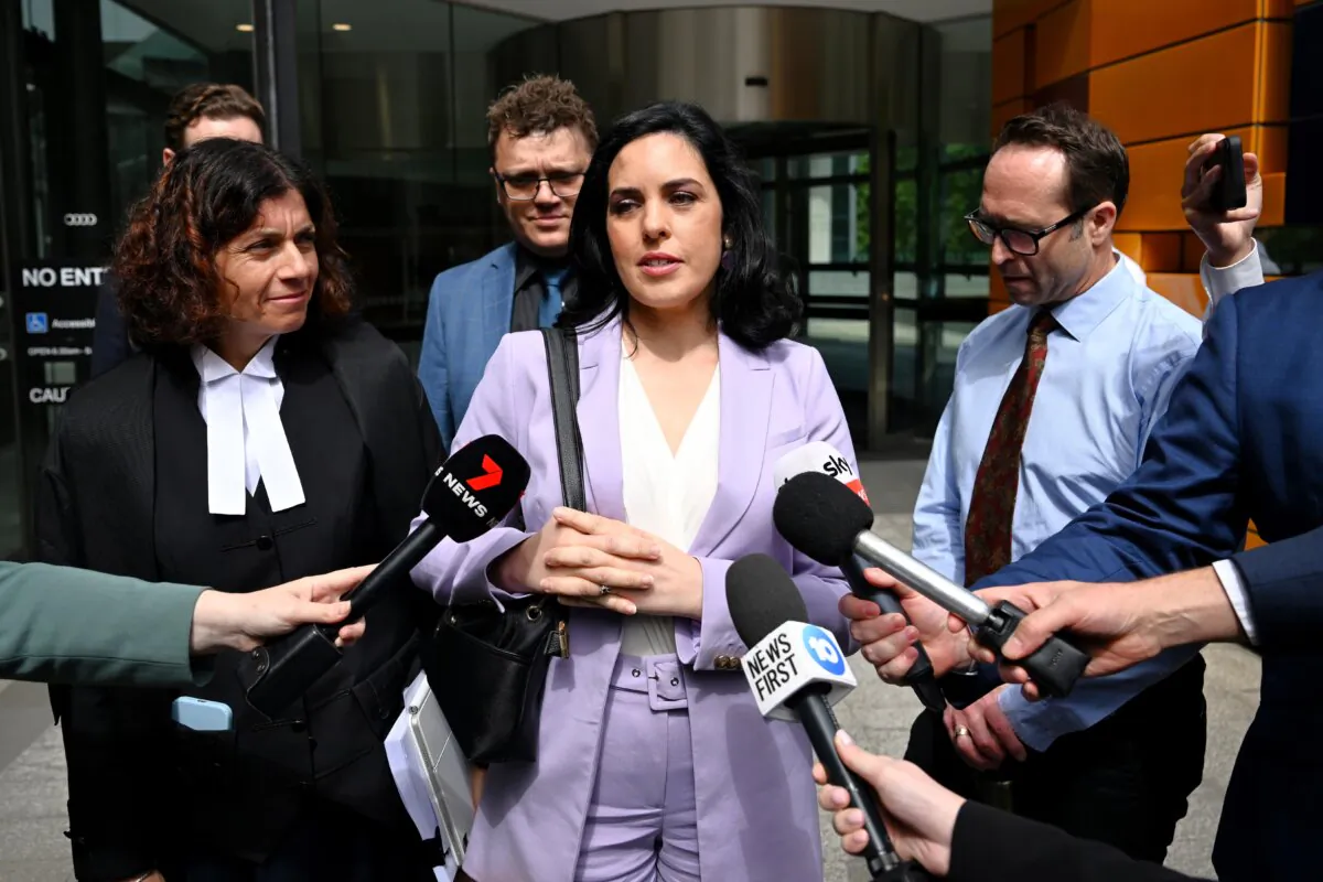 Independent MP Moira Deeming (centre) speaks to media outside the Federal Court of Australia in Melbourne, Australia on Dec. 12, 2024. (AAP Image/Joel Carrett)