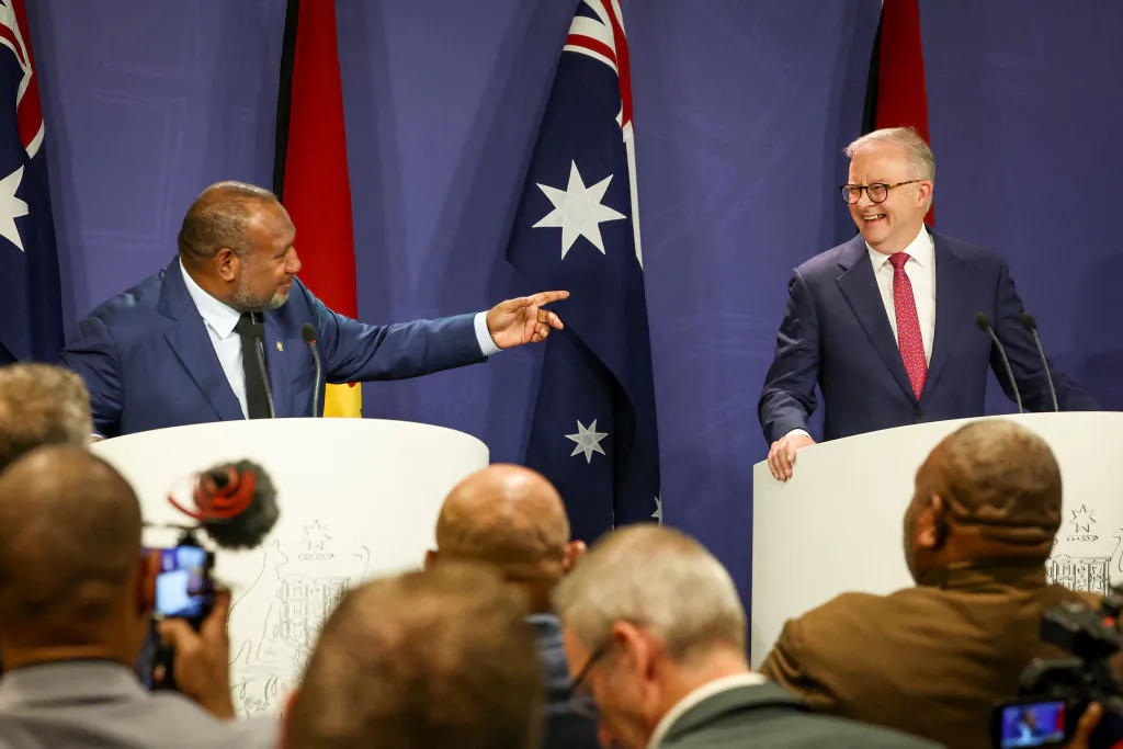Australian Prime Minister Anthony Albanese (R) reacts as Papua New Guinea's Prime Minister James Marape speaks during a press conference in Sydney, Australia, on Dec. 12, 2024. (DAVID GRAY/AFP via Getty Images)