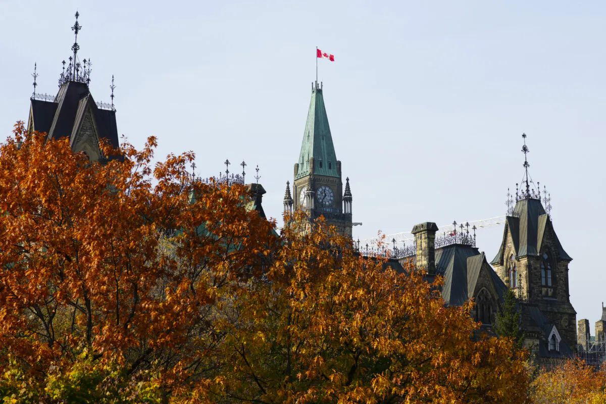 A Canadian flag flies atop the Peace Tower on Parliament Hill in Ottawa on Oct. 30, 2024. (The Canadian Press/Sean Kilpatrick)
