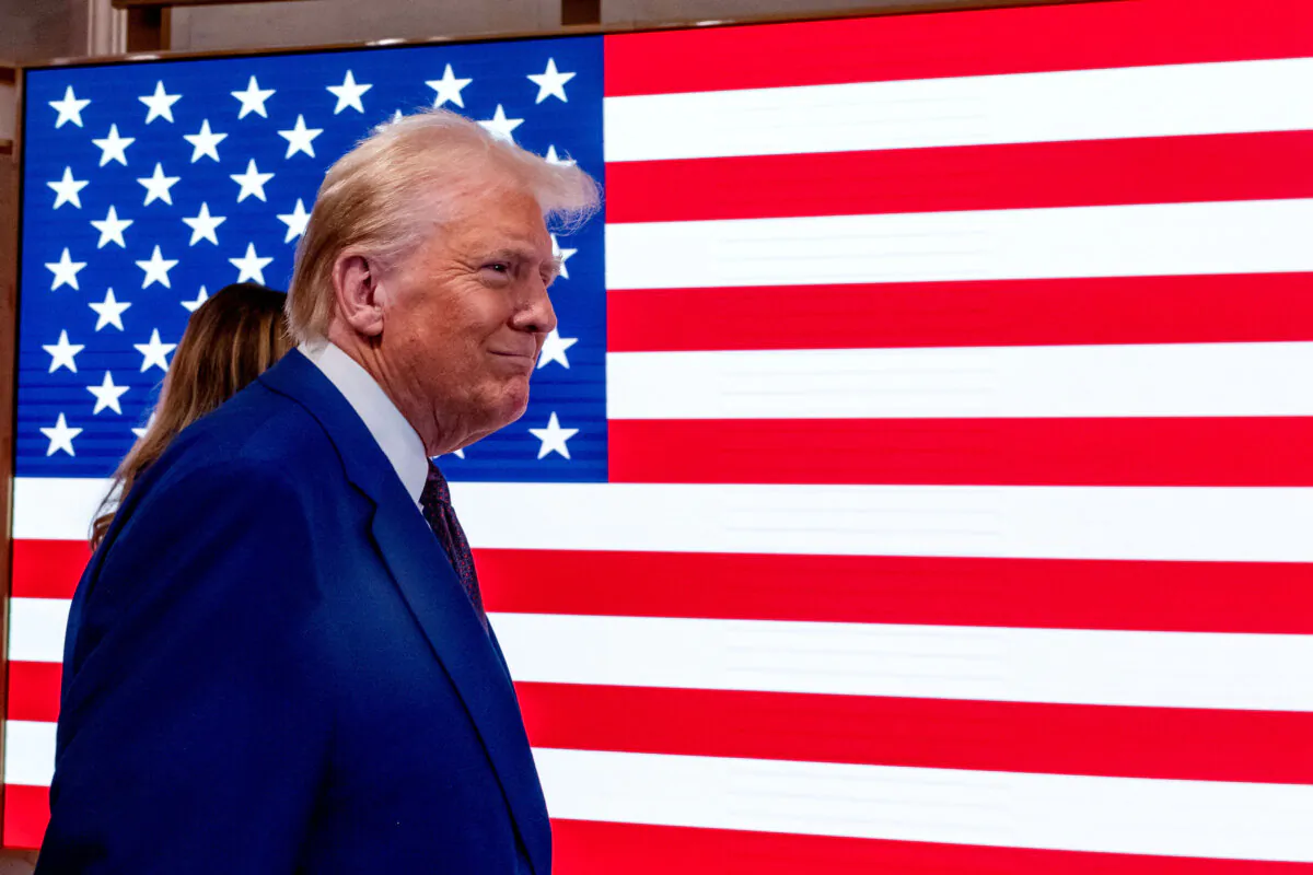 President-elect Donald Trump walks onto the floor of the New York Stock Exchange (NYSE) with his wife Melania after being named TIME’s “Person of the Year” for the second time, in New York on Dec. 12, 2024. (Spencer Platt/Getty Images)