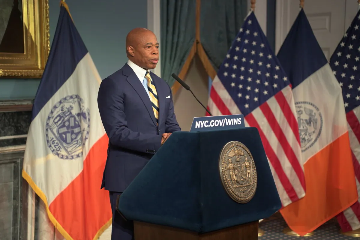 New York City Mayor Eric Adams speaks at a media event after his meeting with border czar Tom Homan in New York City, on Dec. 12, 2024. (Oliver Mantyk/Epoch Times)