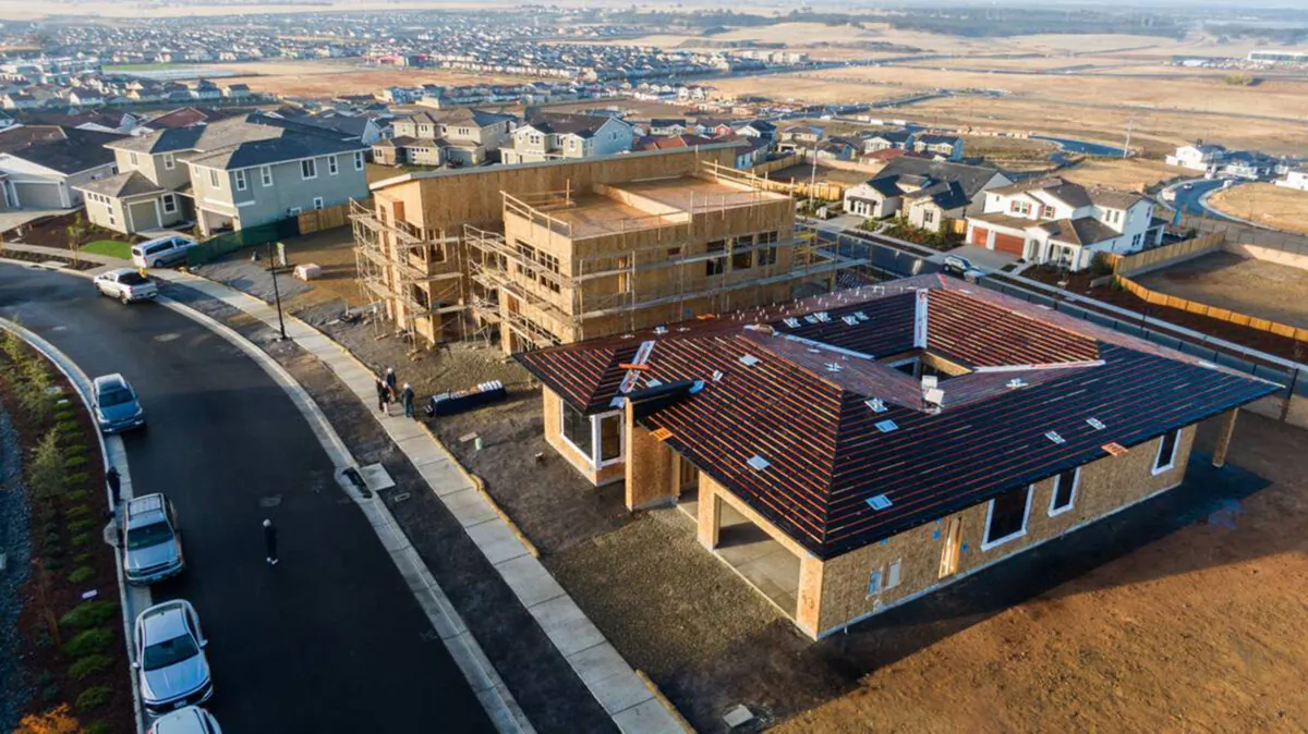 Two homes under construction in Folsom's Shawood housing development are seen from the air on Monday. Japanese homebuilder Sekisui House uses a framing system with precision pre-cut posts and beams. (Hector Amezcua/The Sacramento Bee/TNS)