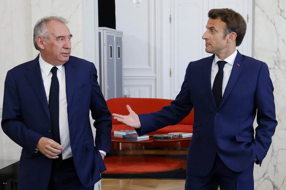 French President Emmanuel Macron (R) meets French centrist party MoDem (Mouvement Democrate) leader Francois Bayrou at the Elysee Palace in Paris, on June 21, 2022. (Ludovic Marin/Pool photo via AP)