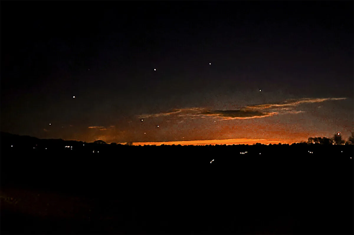 The evening sky and points of light near in Lebanon Township, N.J., on Dec. 5, 2024. (Trisha Bushey via AP)