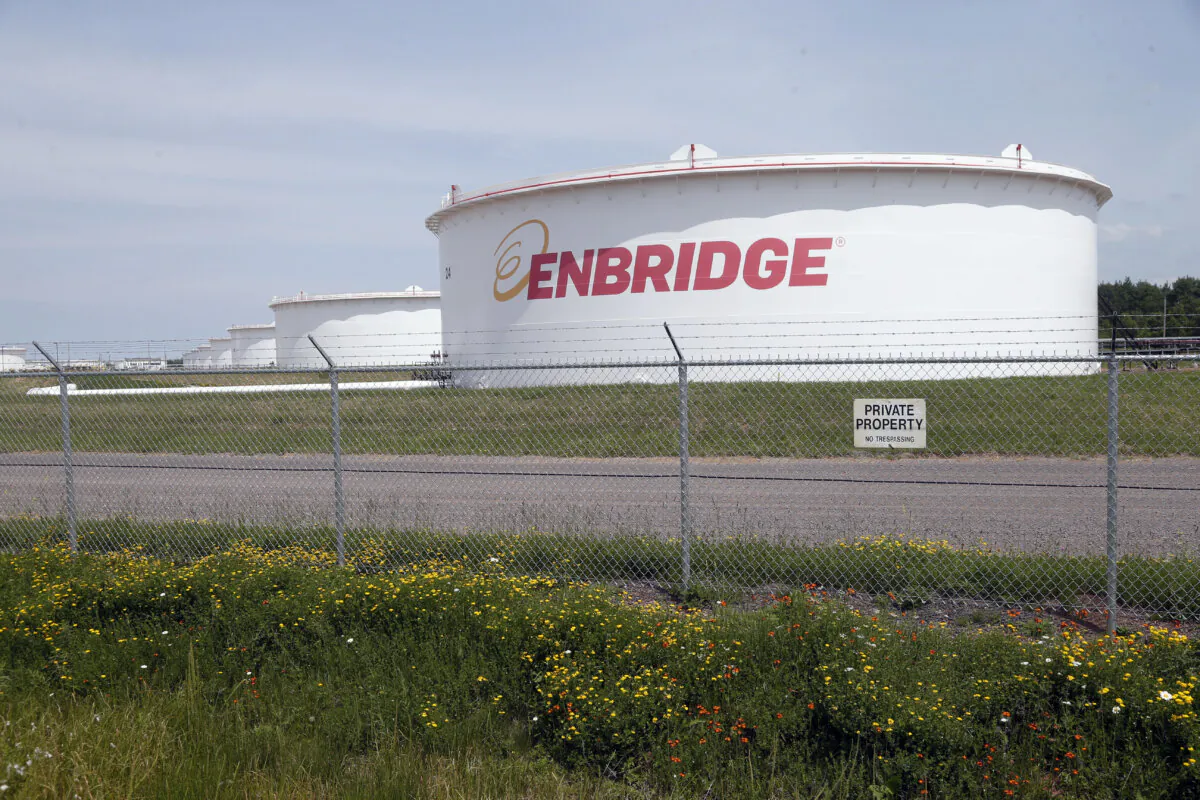 The corporate name stands out on tanks at the Superior terminal of Enbridge Energy in Superior, Wis., on June 29, 2018. (Jim Mone/AP Photo)