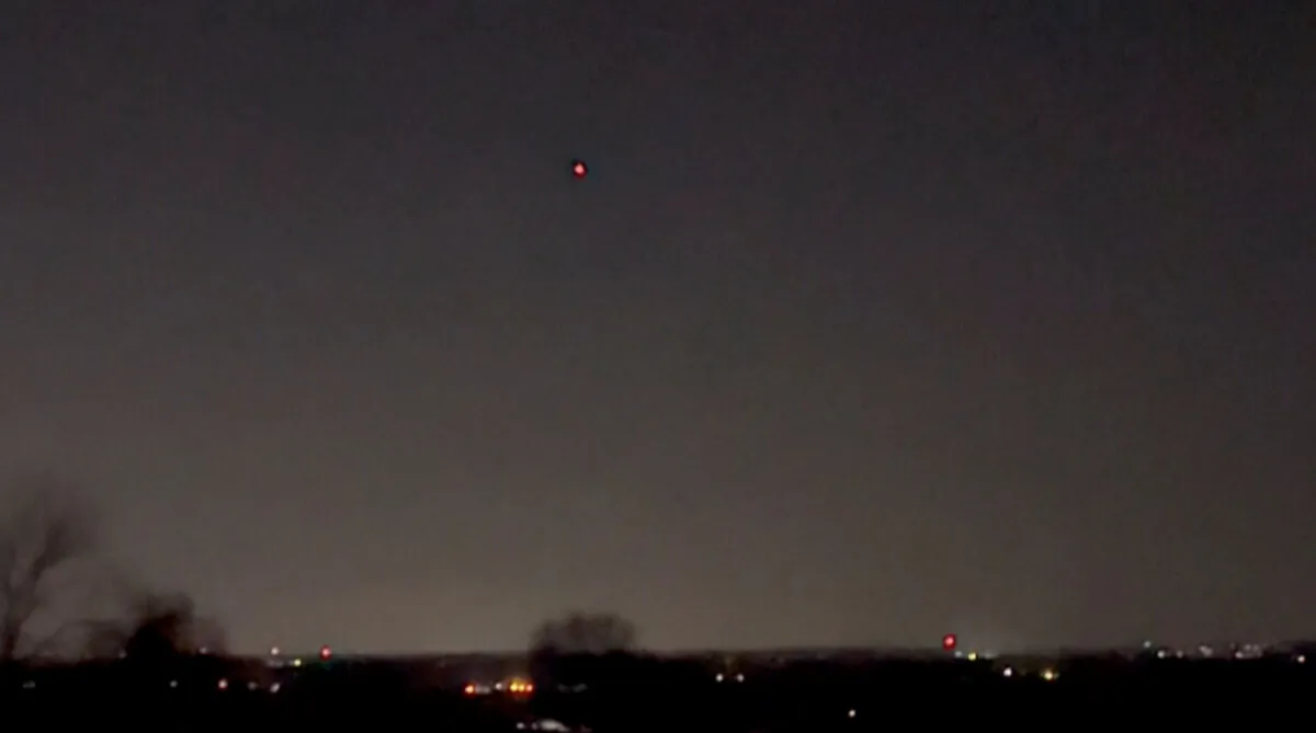 A drone flies over Clinton Township, N.J., on Dec. 5, 2024, in a still from video. (Courtesy of Christopher Stadulis via AP/Screenshot via The Epoch Times)
