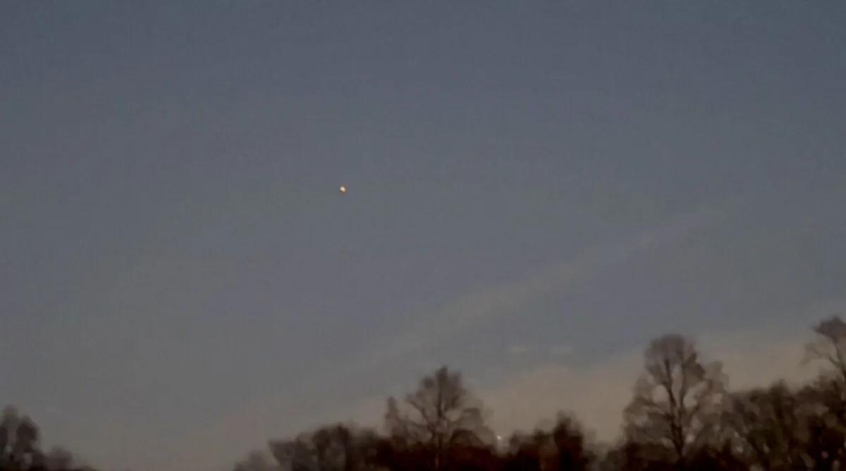 A drone flies over Clinton Township, N.J., on Dec. 12, 2024, in a still from video. (Courtesy of Christopher Stadulis via AP/Screenshot via The Epoch Times)