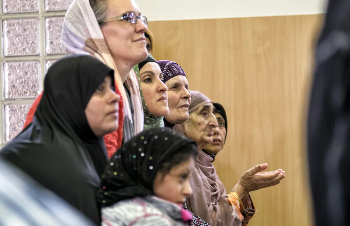 Women listen to a local Imam during National Mosque open day at the Werribee Islamic Centre in the suburb of  Hoppers Crossing in Melbourne, Australia on October 25, 2014. (Luis Ascui/Getty Images)