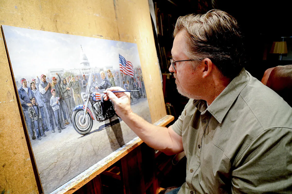 Conservative artist Jon McNaughton adds detail to an acryllic painting of President-elect Donald Trump and First Lady Melania Trump titled "MAGA Ride" in McNaughton's studio in Provo, Utah, on Nov. 18, 2024. (Allan Stein/The Epoch Times)