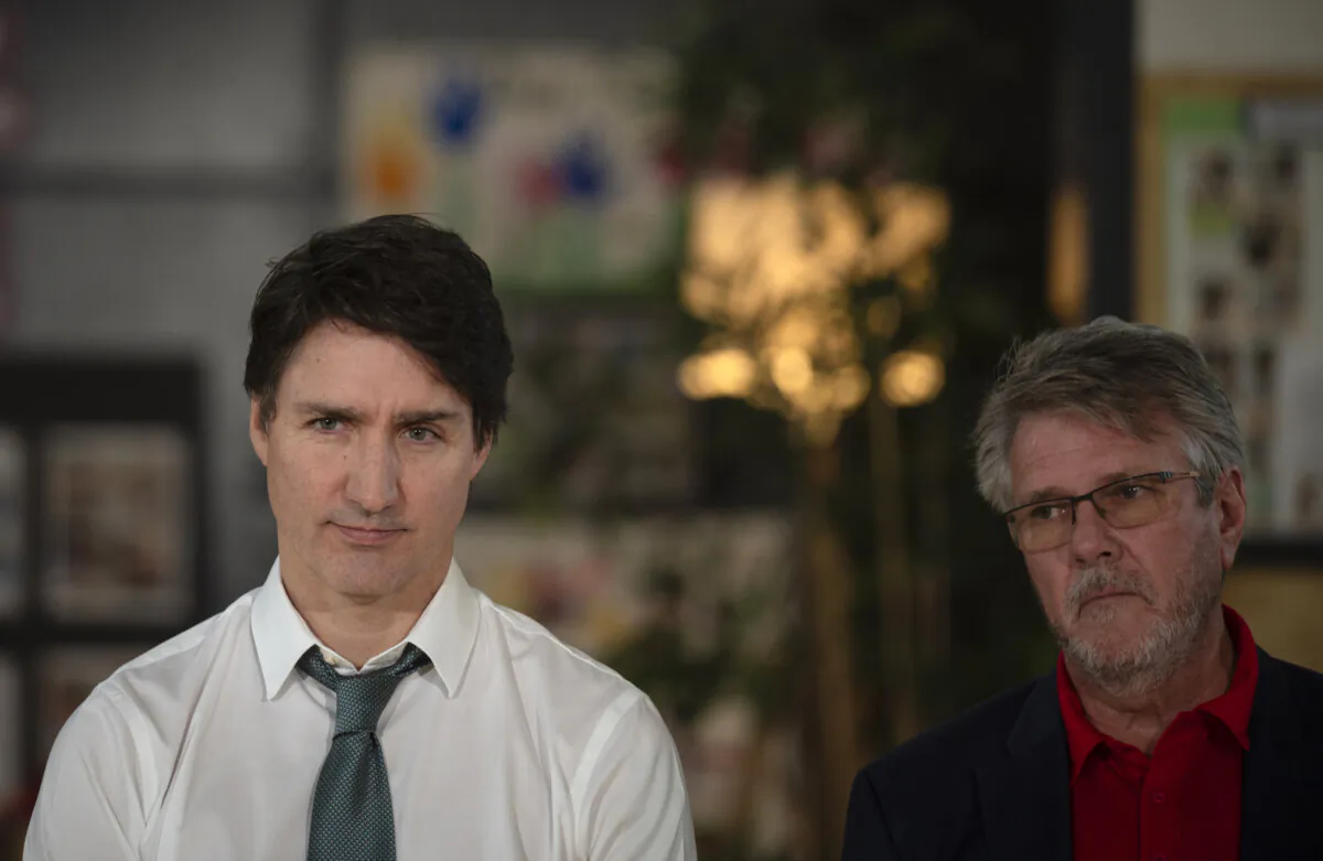 Prime Minister Justin Trudeau and MP John Aldag listen during a press conference in Surrey, B.C, on March 28, 2024. (THE CANADIAN PRESS/ Tijana Martin)