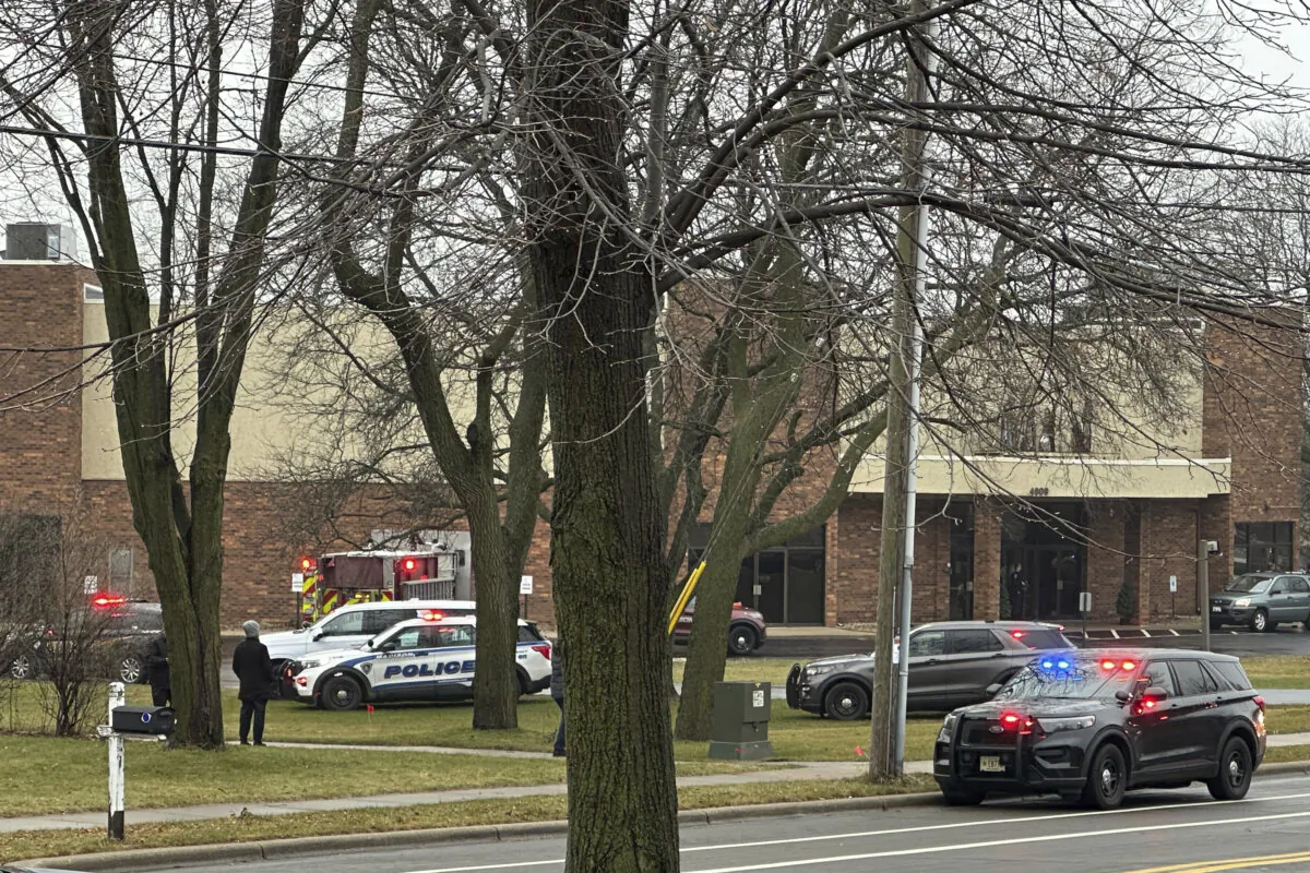 Emergency vehicles are parked outside the Abundant Life Christian School in Madison, Wis., where multiple deaths were reported following a shooting, on Dec. 16, 2024. (Scott Bauer/AP Photo)