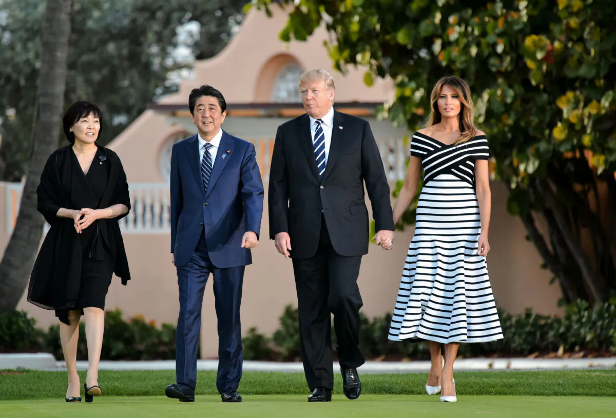 Japanese Prime Minister Shinzo Abe (2nd L) and his wife, First Lady Akie Abe, walk with President Donald Trump and First Lady Melania Trump before dinner at Trump's Mar-a-Lago resort in Palm Beach, Fla., on April 17, 2018. (Mandel NganAFP/Getty Images)