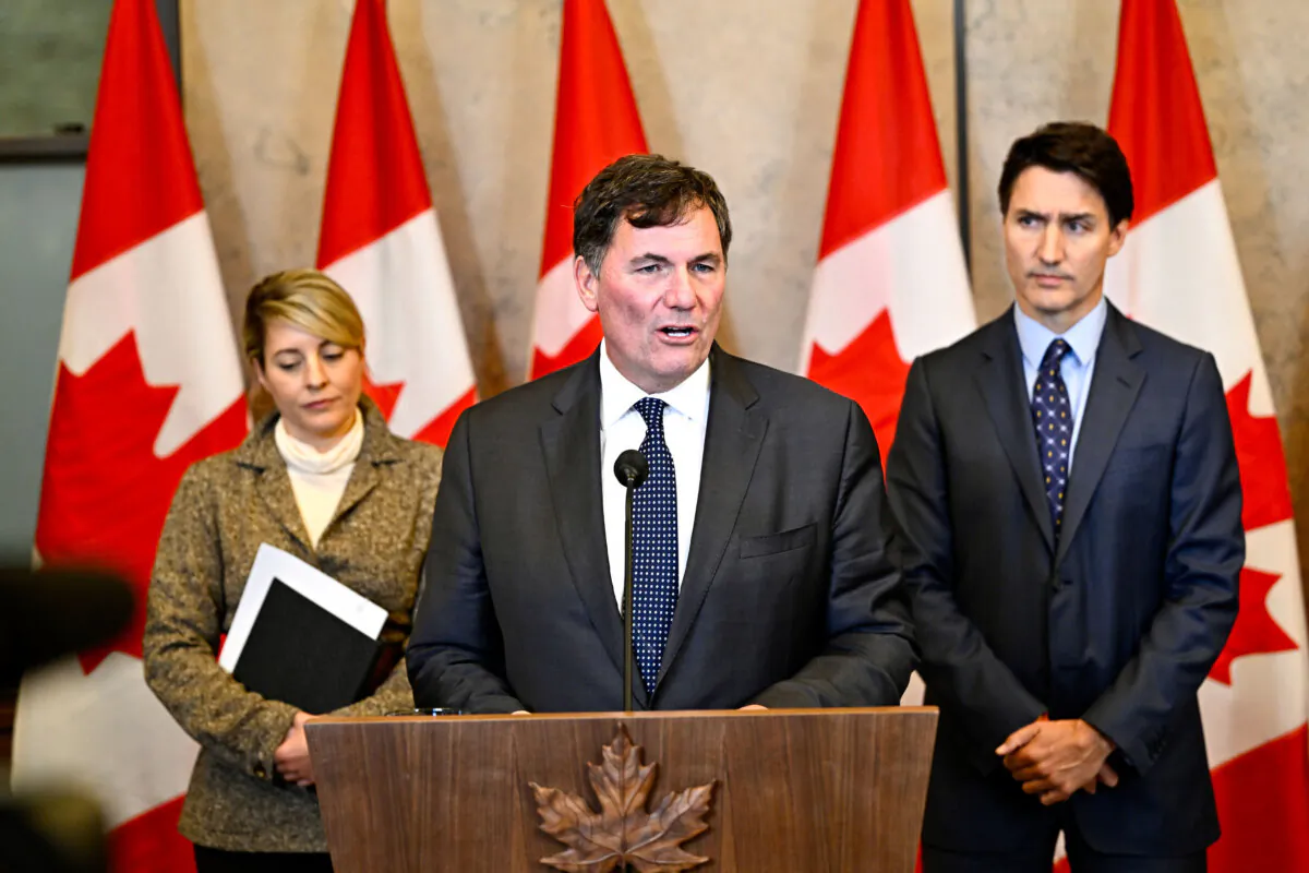 Then-Public Safety Minister Dominic LeBlanc (C), Prime Minister Justin Trudeau (R), and Minister of Foreign Affairs Melanie Joly participate in a news conference on Parliament Hill in Ottawa, on Oct. 14, 2024. (The Canadian Press/Justin Tang)