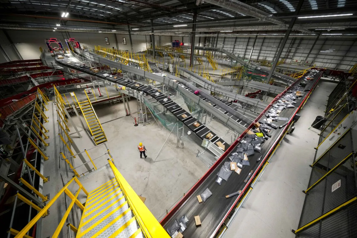 A worker looks on as parcels are transferred at a postal depot in Daventry, England, on Dec. 16, 2024. (Christopher Furlong/Getty Images)