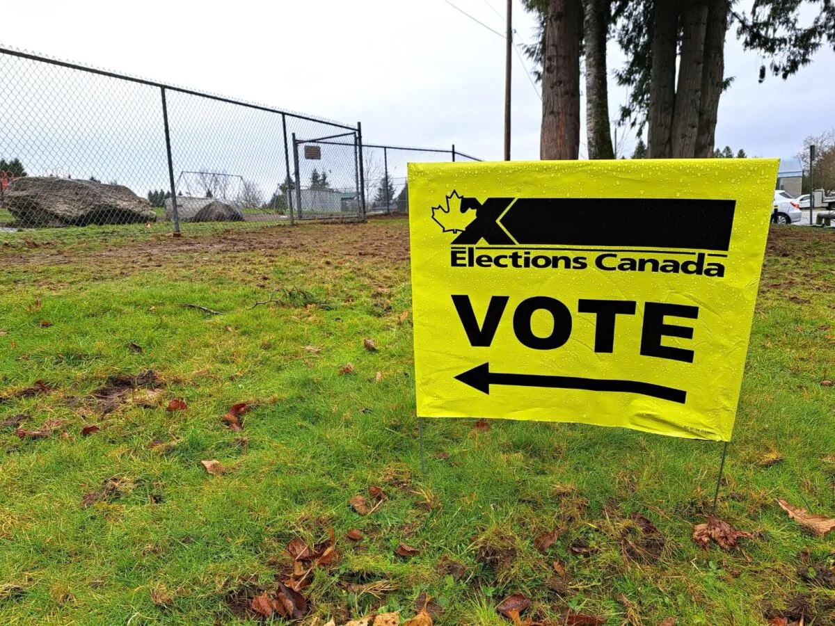 An election sign outside the polling station at George Greenaway Elementary School in Surrey, B.C., on Dec. 16, 2024. (Jeff Sandes/The Epoch Times)