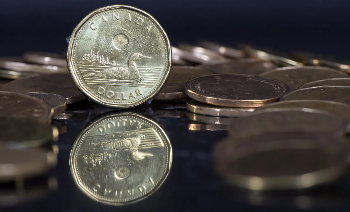Canadian dollar coins are displayed in Montreal, on Jan. 30, 2015. (The Canadian Press/Paul Chiasson)