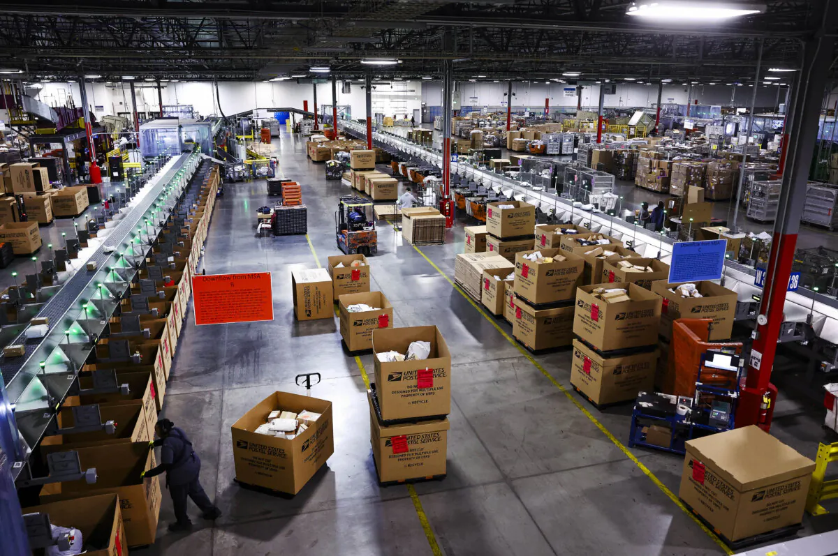 U.S. Postal Service employees work during the start of the holiday mail rush inside the Los Angeles Mail Processing & Distribution Center in Los Angeles on Dec. 3, 2024. (Mario Tama/Getty Images)