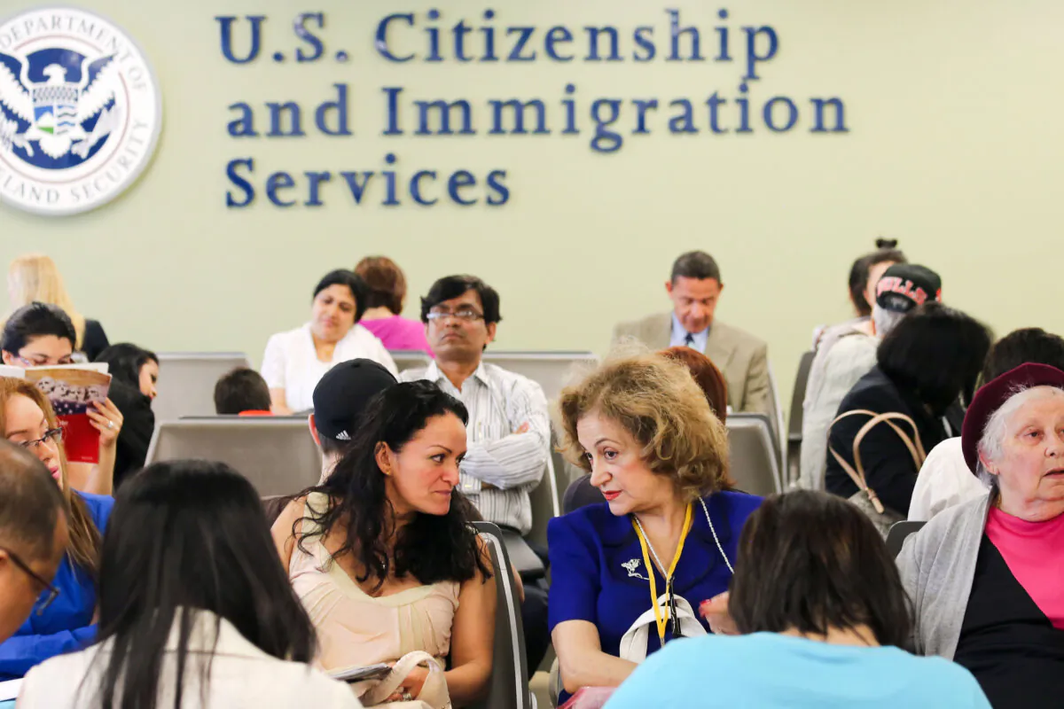 Immigrants wait for interviews at the U.S. Citizenship and Immigration Services Queens office in the Long Island City neighborhood of New York City on May 30, 2013. (John Moore/Getty Images)