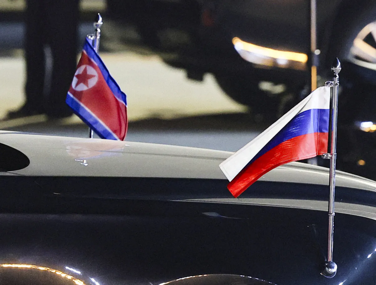 Russian and North Korean flags on a car during a ceremony welcoming Russian President Vladimir Putin to Pyongyang, North Korea, on June 19, 2024. (Sputnik/Vladimir Smirnov/Pool via Reuters) 