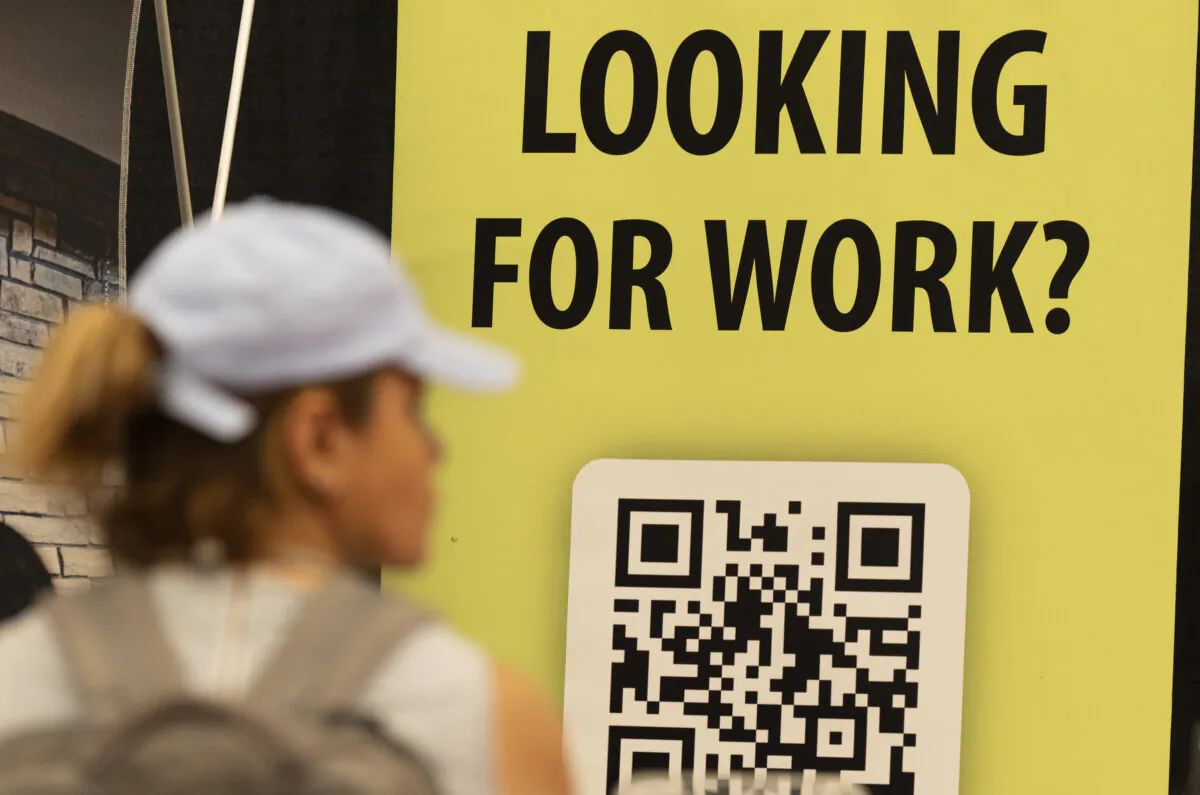 People attend a job and continuing education fair in Montreal, on Oct. 5, 2023. (The Canadian Press/Christinne Muschi)