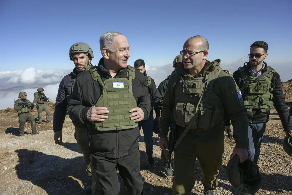 Israel's Prime Minister Benjamin Netanyahu (L) visits Israeli forces in a buffer zone inside Syria on Dec. 17, 2024. (Israel Government Press Office via AP)