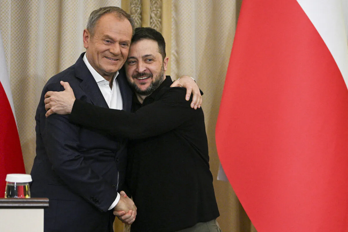 Ukrainian President Volodymyr Zelensky (R) and Polish Prime Minister Donald Tusk shake hands at the end of their press conference in Lviv, Ukraine, on Dec. 17, 2024. (Yuriy Dyachyshyn/AFP via Getty Images)