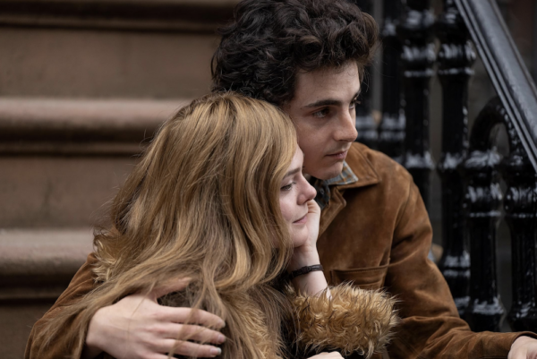 woman with strawberry blond hair and man in brown jacket in A Complete Unknown