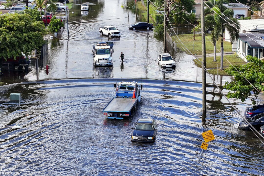 Day in Photos: Flooded Florida, Argentina Plane Crash, Concert at the Royal Palace