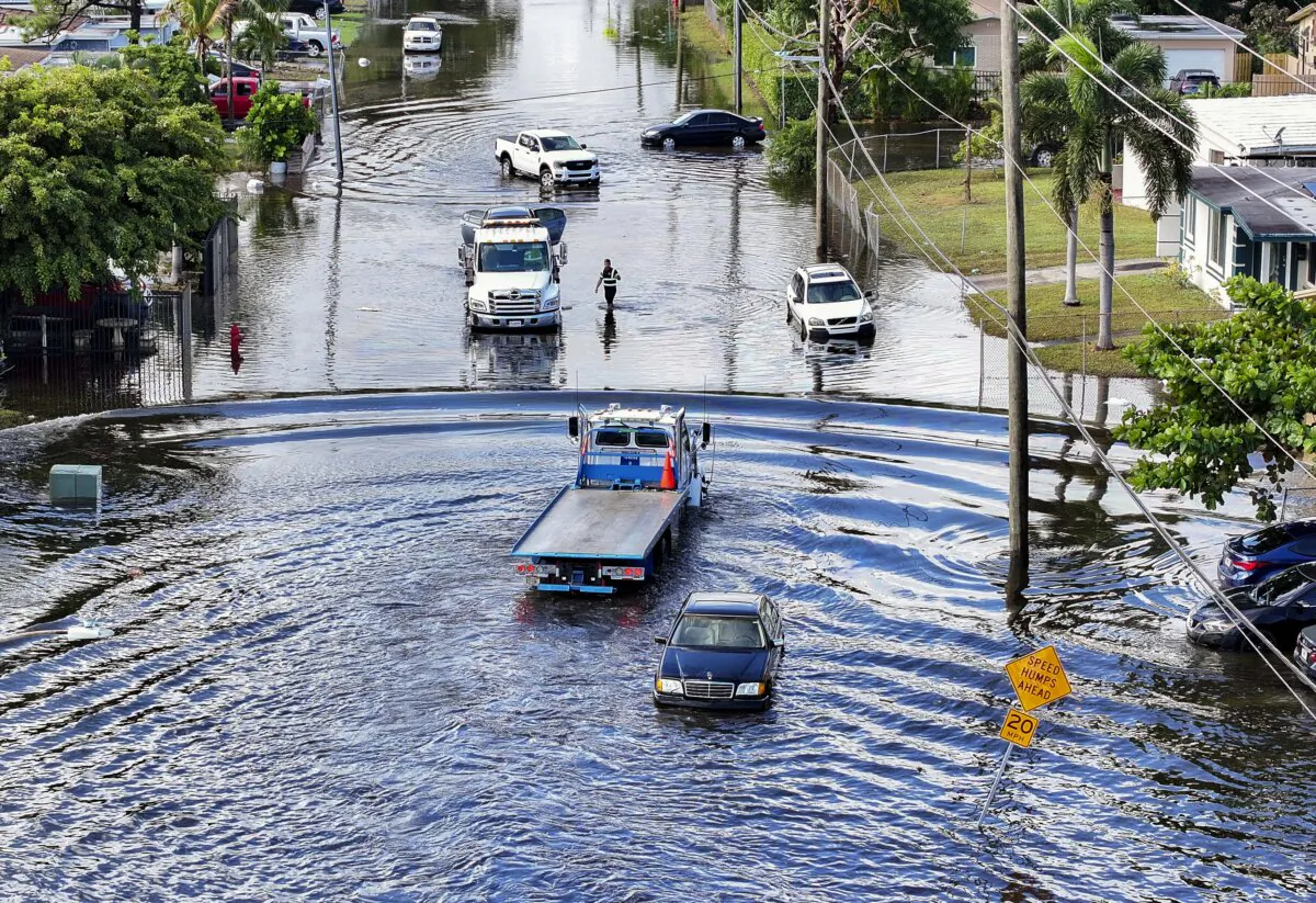An aerial view of tow trucks on a flooded residential neighborhood street after heavy rain in Fort Lauderdale, Fla., on Dec. 18, 2024. (Joe Raedle/Getty Images)