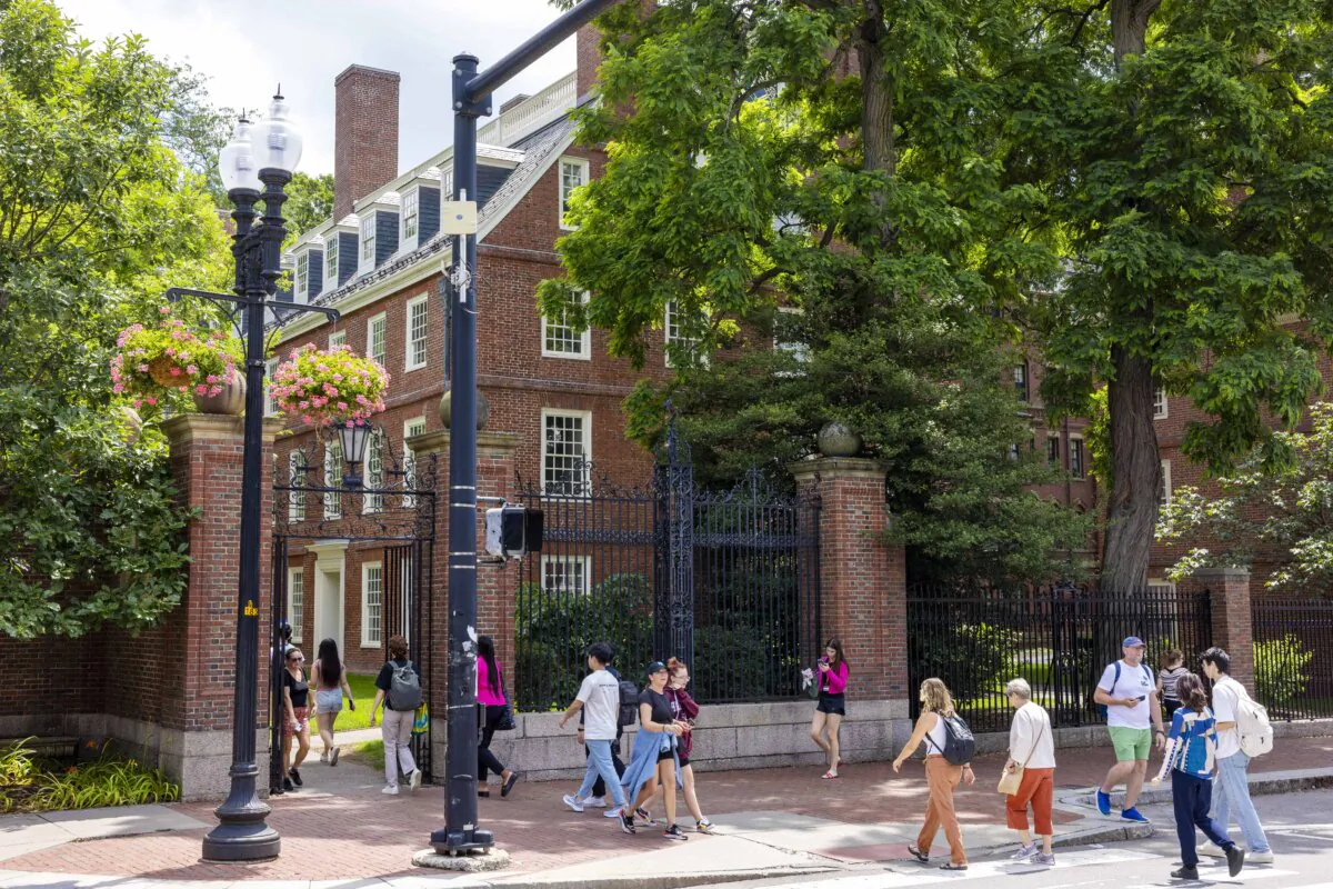 People walk through the gate on Harvard Yard at the Harvard University campus in Cambridge, Mass., on June 29, 2023. (Scott Eisen/Getty Images)