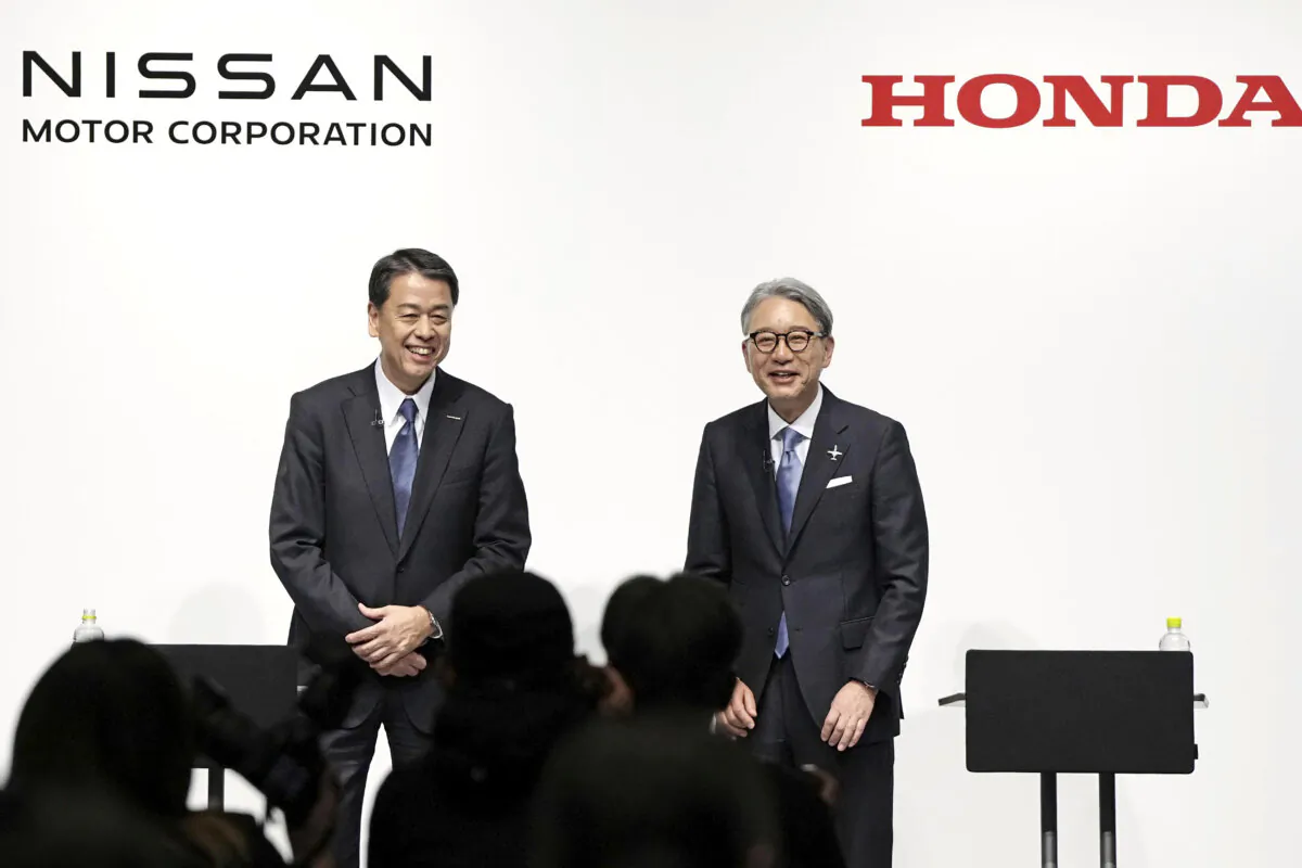 Nissan Chief Executive Makoto Uchida (L) and Honda President Toshihiro Mibe attend a joint press conference in Tokyo on March 15, 2024. (Kyodo News via AP)