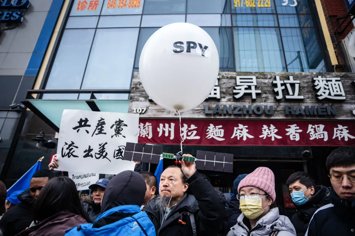 People at a press conference and rally in front of the America ChangLe Association, a now-closed secret Chinese police station,  highlighting Beijing's transnational repression, in New York City on Feb. 25, 2023. (Samira Bouaou/The Epoch Times)
