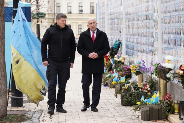 Defence Secretary John Healey (R) with Deputy Minister of Defence of Ukraine for European Integration Serhii Boyev (L), laying flowers at the Wall of Remembrance of the Fallen for Ukraine, which remembers those killed during the conflict with Russia, during a visit to Kyiv, Ukraine, on Dec. 18, 2024. (Stefan Rousseau/PA Wire)