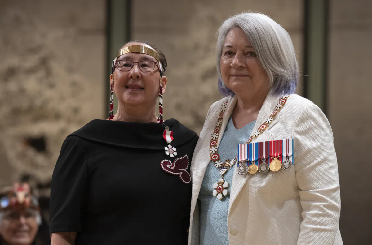 Gov. Gen. Mary Simon stands with Nancy Karetak-Lindell after investing her in the Order of Canada during a National Indigenous Peoples Day ceremony at Rideau Hall, in Ottawa, on June 21, 2023. (The Canadian Press/Adrian Wyld)