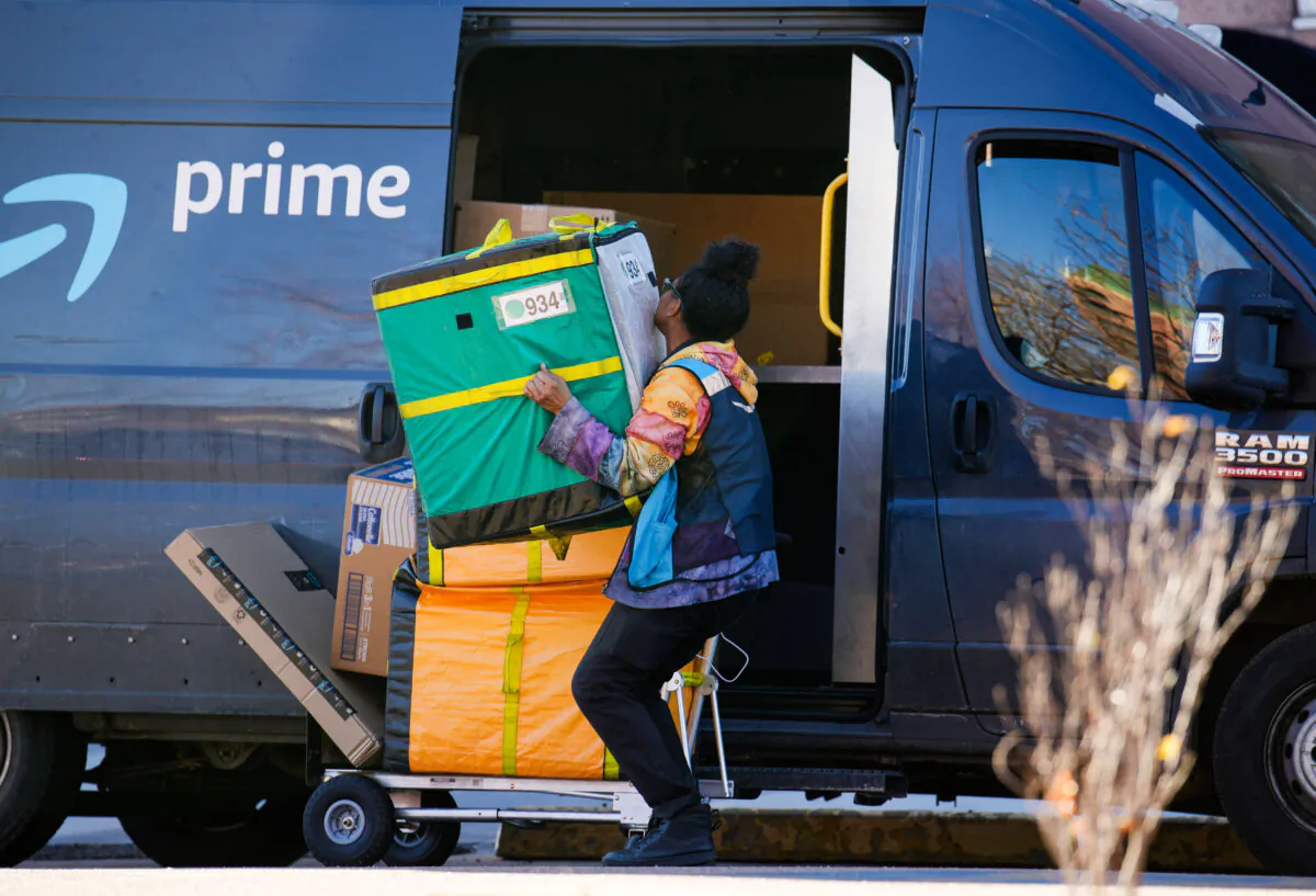 An Amazon Prime delivery person makes a stop in Denver on Nov. 28, 2023. (David Zalubowski, File /AP Photo)