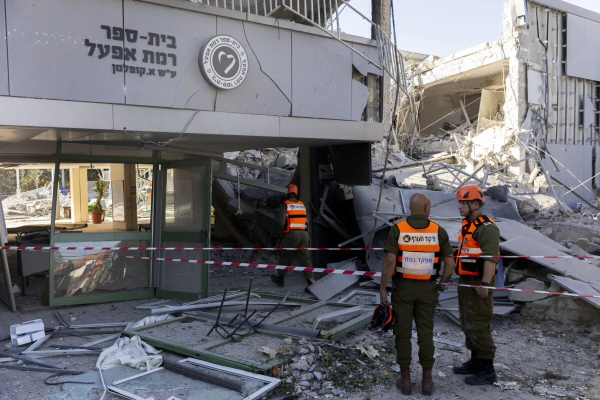 Emergency responders inspect damage at a school in the city after a rocket strike, allegedly fired from Yemen, on Dec. 19, 2024, in Ramat Gan, Israel. In response, Israel launched attacks on several Houthi military targets in Yemen. (Amir Levy/Getty Images)