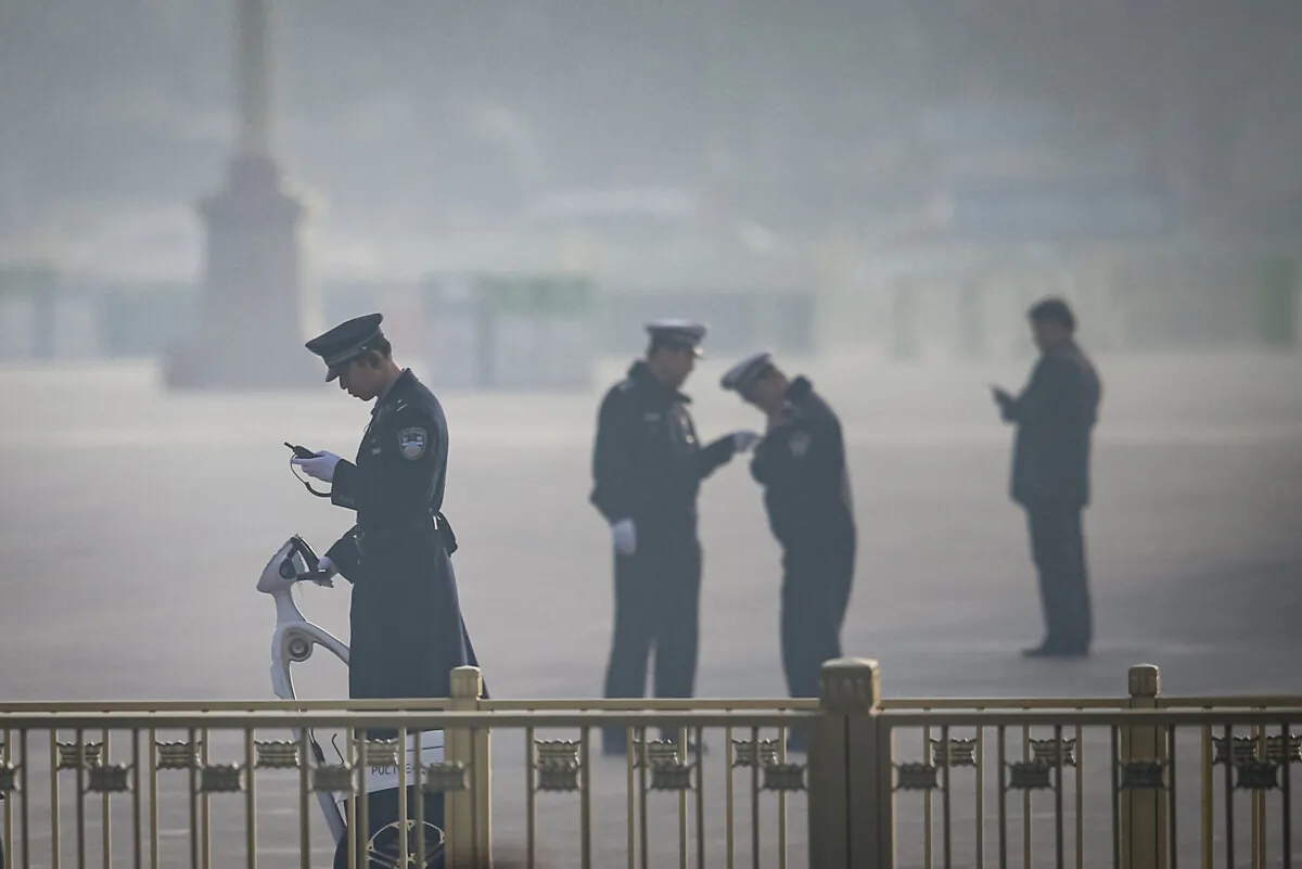 Policemen on Tiananmen Square in Beijing on March 8, 2013. (Feng Li/Getty Images)