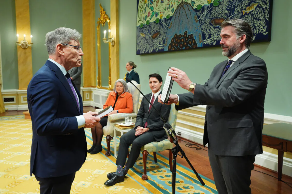 Minister of Sport Terry Duguid is sworn in by Clerk of the Privy Council John Hannaford during a cabinet swearing-in ceremony at Rideau Hall in Ottawa on Dec. 20, 2024. (The Canadian Press/Sean Kilpatrick)