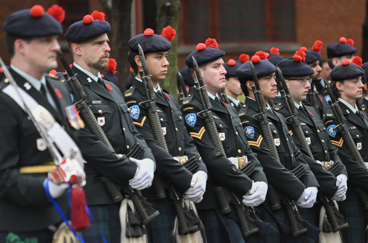 Members of the Canadian Armed Forces stand to attention during a Remembrance Day ceremony in Montreal on Nov. 11, 2024. (The Canadian Press/Graham Hughes)