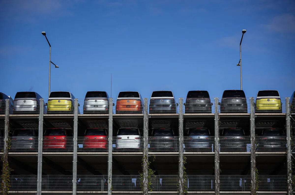 New VW ID Buzz vehicles, fully electric-driven microbus cars from Volkswagen Commercial Vehicles, are seen parked before delivery at the commercial vehicle plant of Volkswagen (VW) in Hanover, northern Germany, on Dec. 20, 2024. (Ronny Hartmann / AFP via Getty Images)