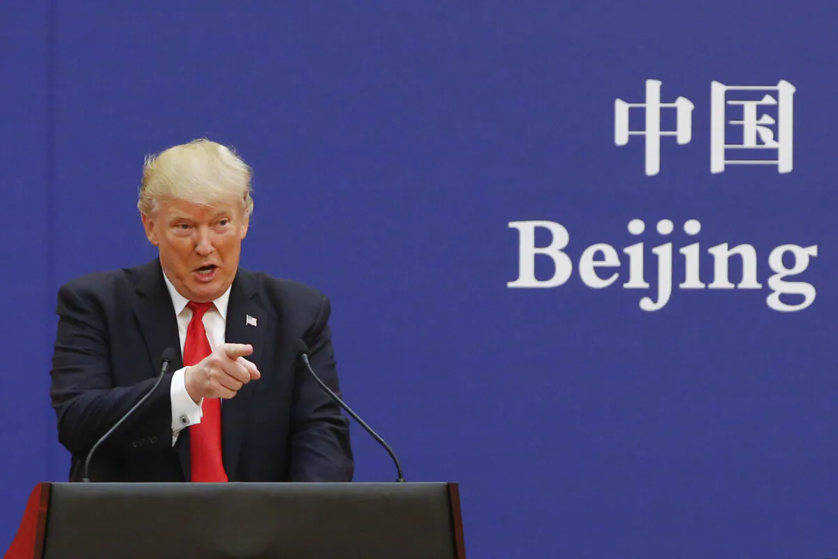 U.S. President Donald Trump and Chinese leader Xi Jinping (not shown) speak to business leaders at the Great Hall of the People on November 9, 2017 in Beijing, China. (Thomas Peter-Pool/Getty Images)