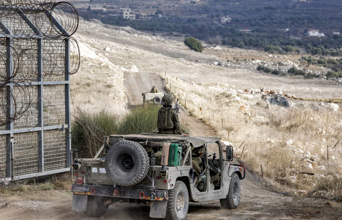 Israeli army humvees move in the U.N.-patrolled buffer zone separating Israeli and Syrian forces on the Golan Heights near the Druze village of Majdal Shams in the Israel-annexed Golan Heights on Dec. 21, 2024. (Jalaa Marey/AFP via Getty Images)