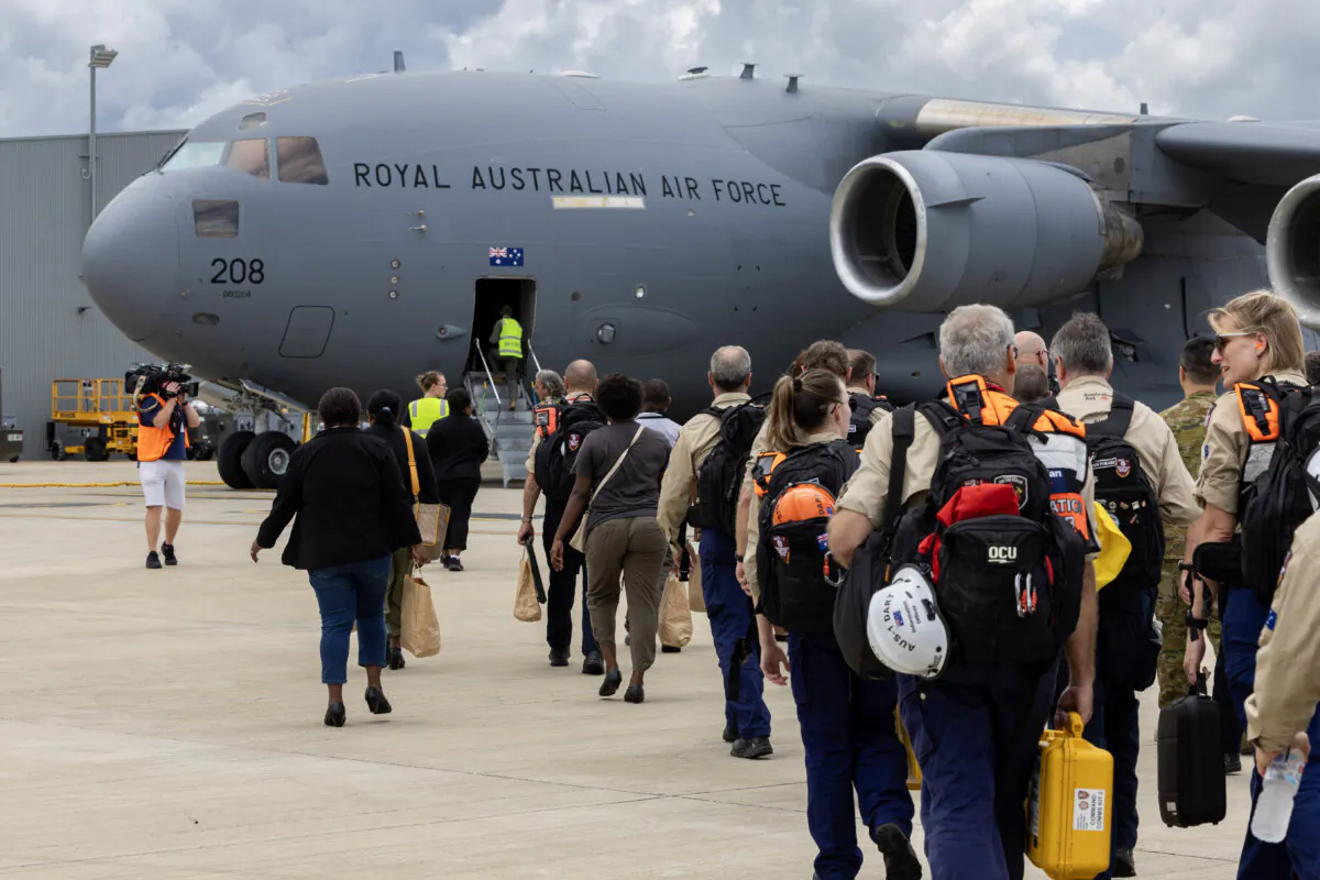 Disaster assistance response team personnel board a Royal Australian Air Force C-17A Globemaster III bound for Vanuatu at RAAF Base Amberley, Australia, on Dec. 18, 2024. (Campbell Latch/Department of Defence)