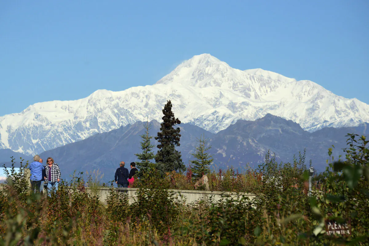Visitors take in the view of Denali, formerly known as Mount McKinley, in Denali National Park, Alaska, on Sept. 1, 2015. (Lance King/Getty Images)