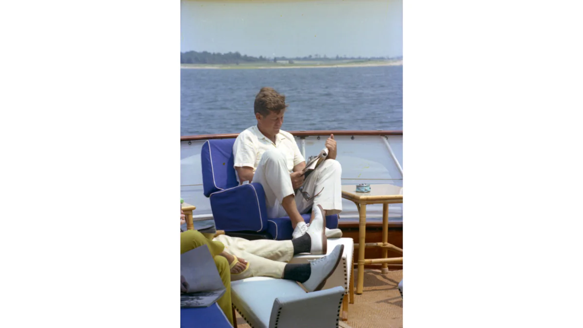 President John F. Kennedy reading during his downtime. (John F. Kennedy Presidential Library and Museum)