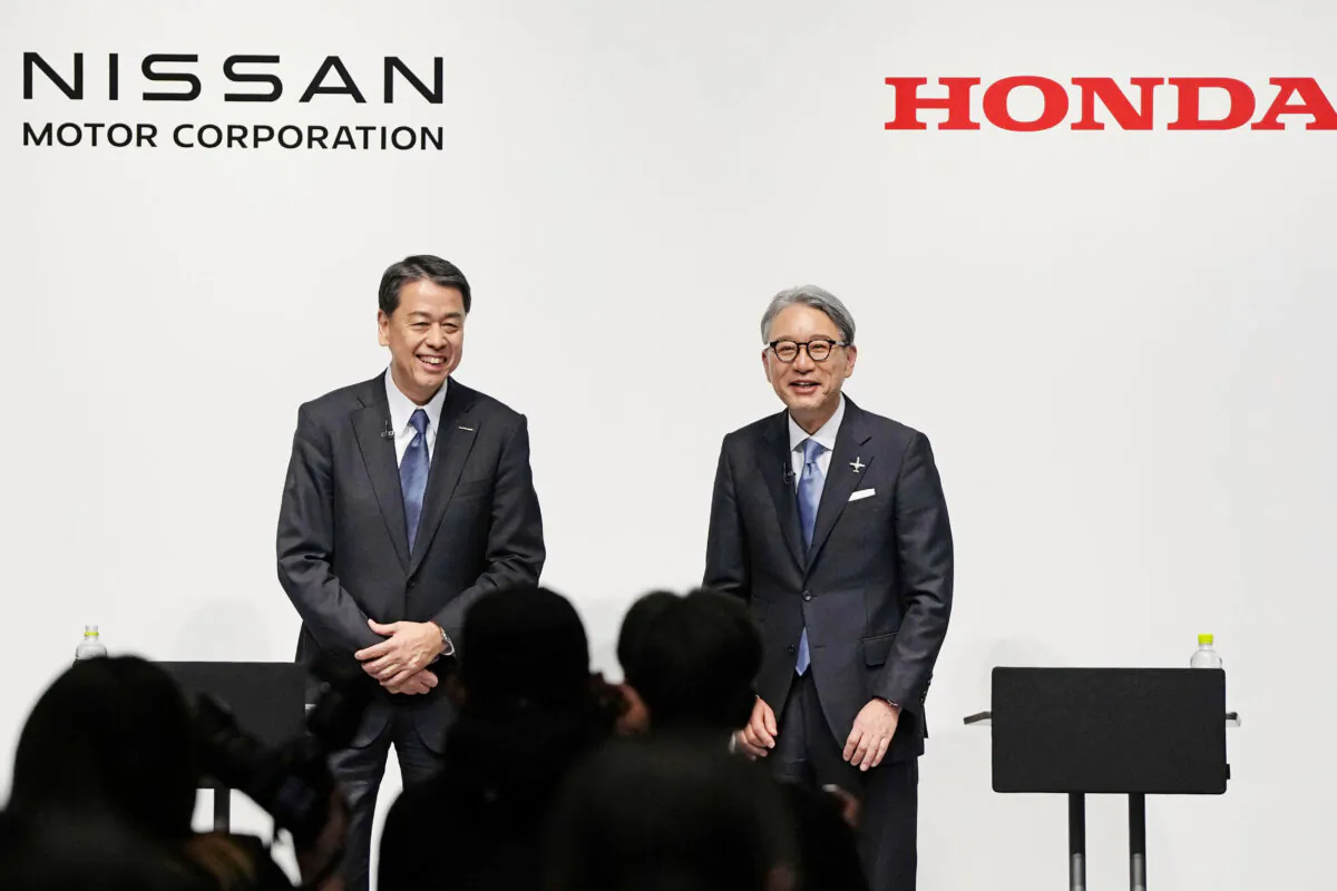 Nissan Chief Executive Makoto Uchida (L) and Honda President Toshihiro Mibe attend a joint news conference in Tokyo on March 15, 2024. (Kyodo News via AP)
