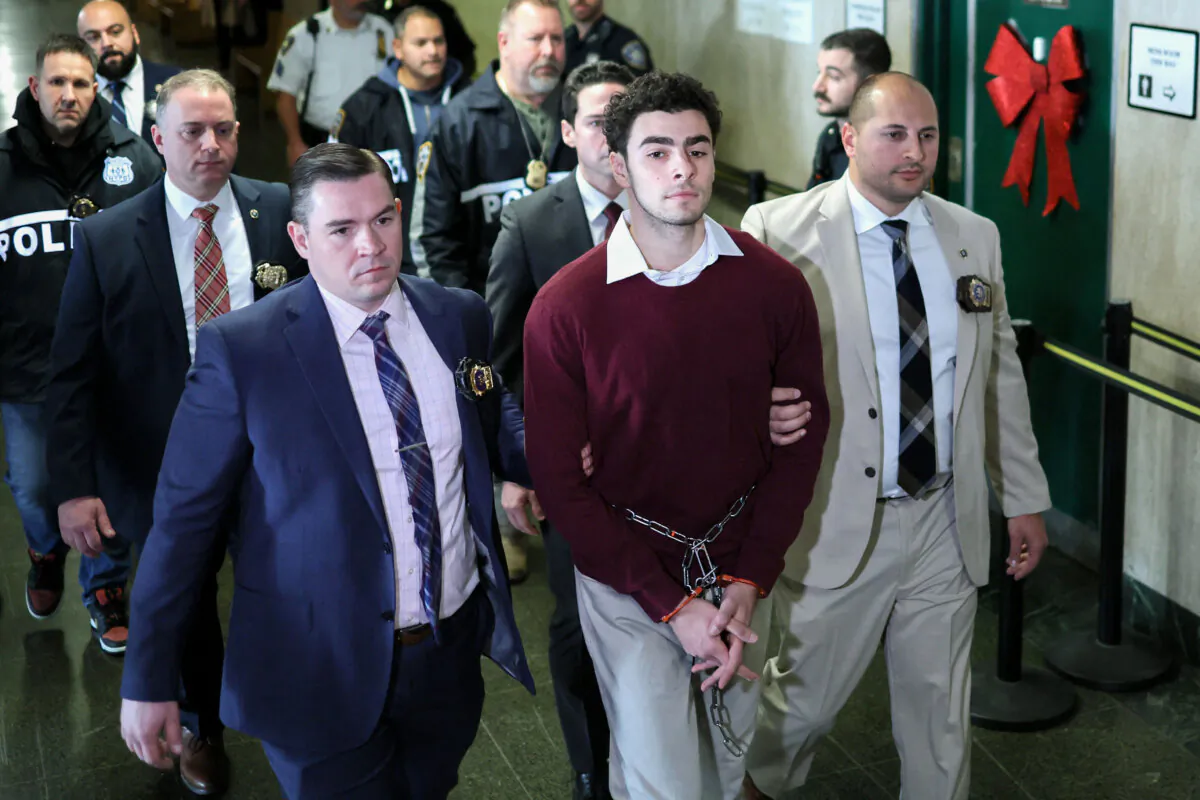 Luigi Nicholas Mangione (C) arrives at Manhattan Criminal Court in New York on Dec. 23, 2024. (Charly Triballeau/AFP via Getty Images)