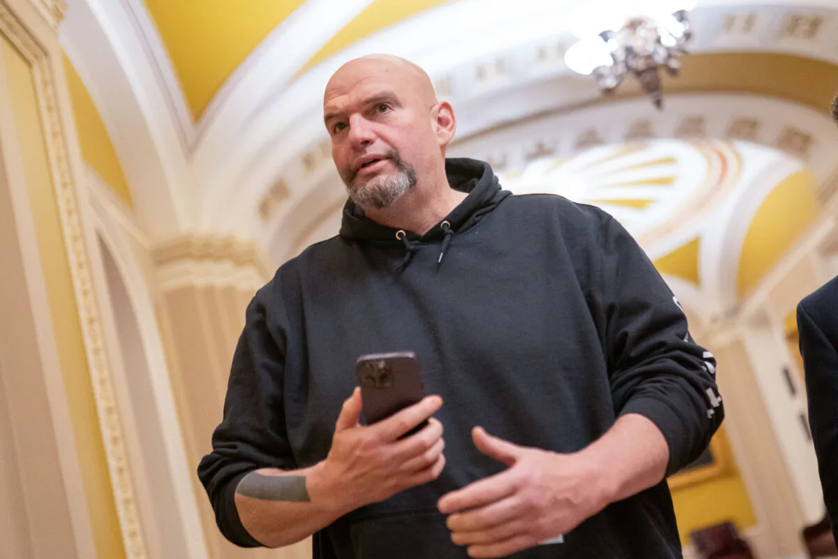 U.S. Sen. John Fetterman (D-Pa.) walks toward the Senate Chamber in Washington on March 23, 2024. (Nathan Howard/Getty Images)