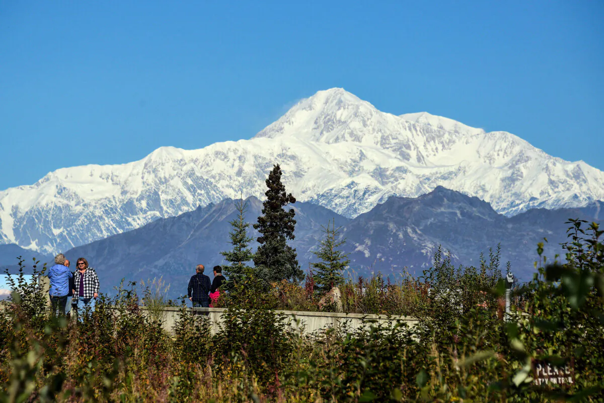 Visitors take in the view of Denali, formerly known as Mt. McKinley in Denali National Park, Ala., on Sept. 1, 2015. (Lance King/Getty Images)