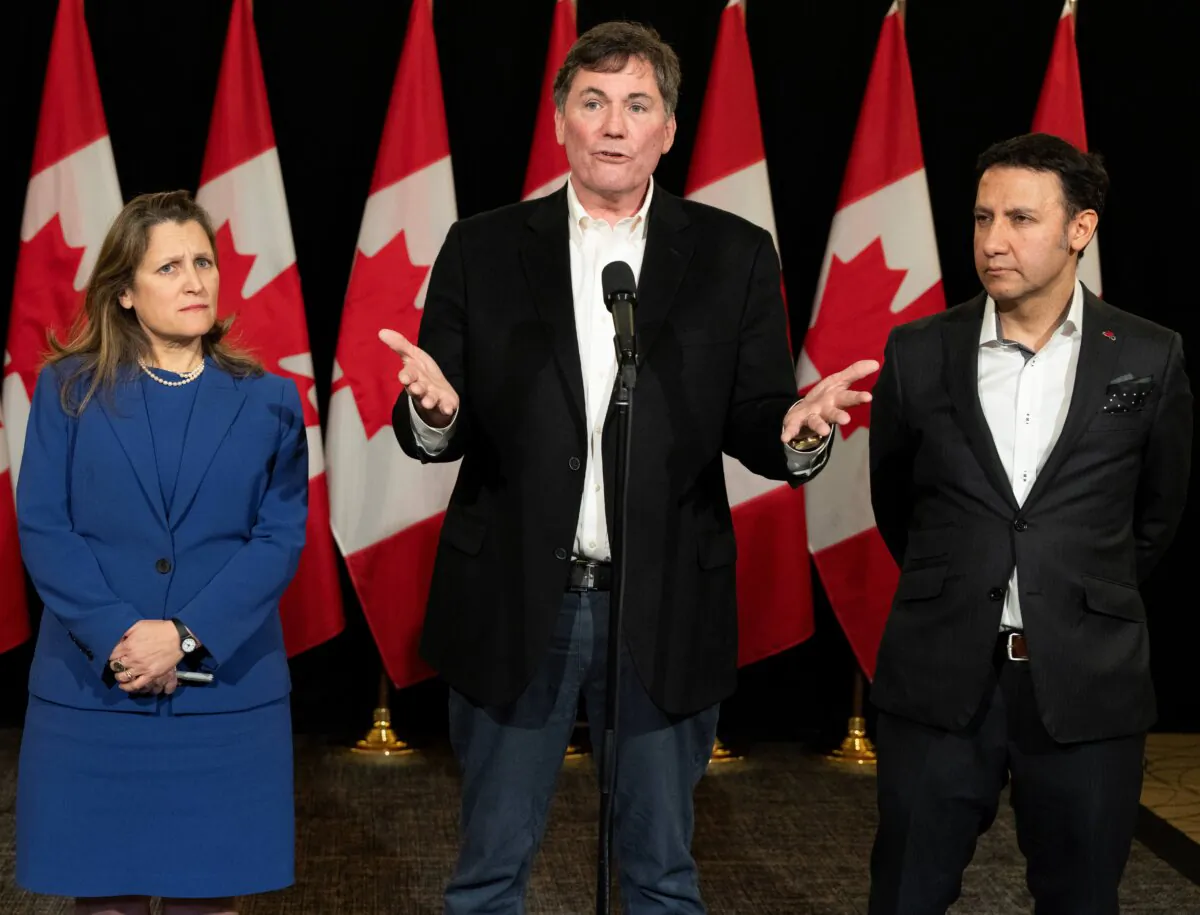Cabinet ministers Chrystia Freeland (L), Dominic LeBlanc (C), and Arif Virani participate in a press conference in Montreal on Jan. 23, 2024. (The Canadian Press/Christinne Muschi)

